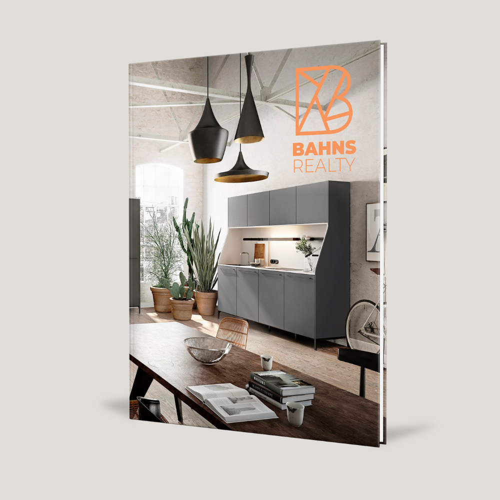 Real estate marketing book with interior design cover and Bahns Realty logo
