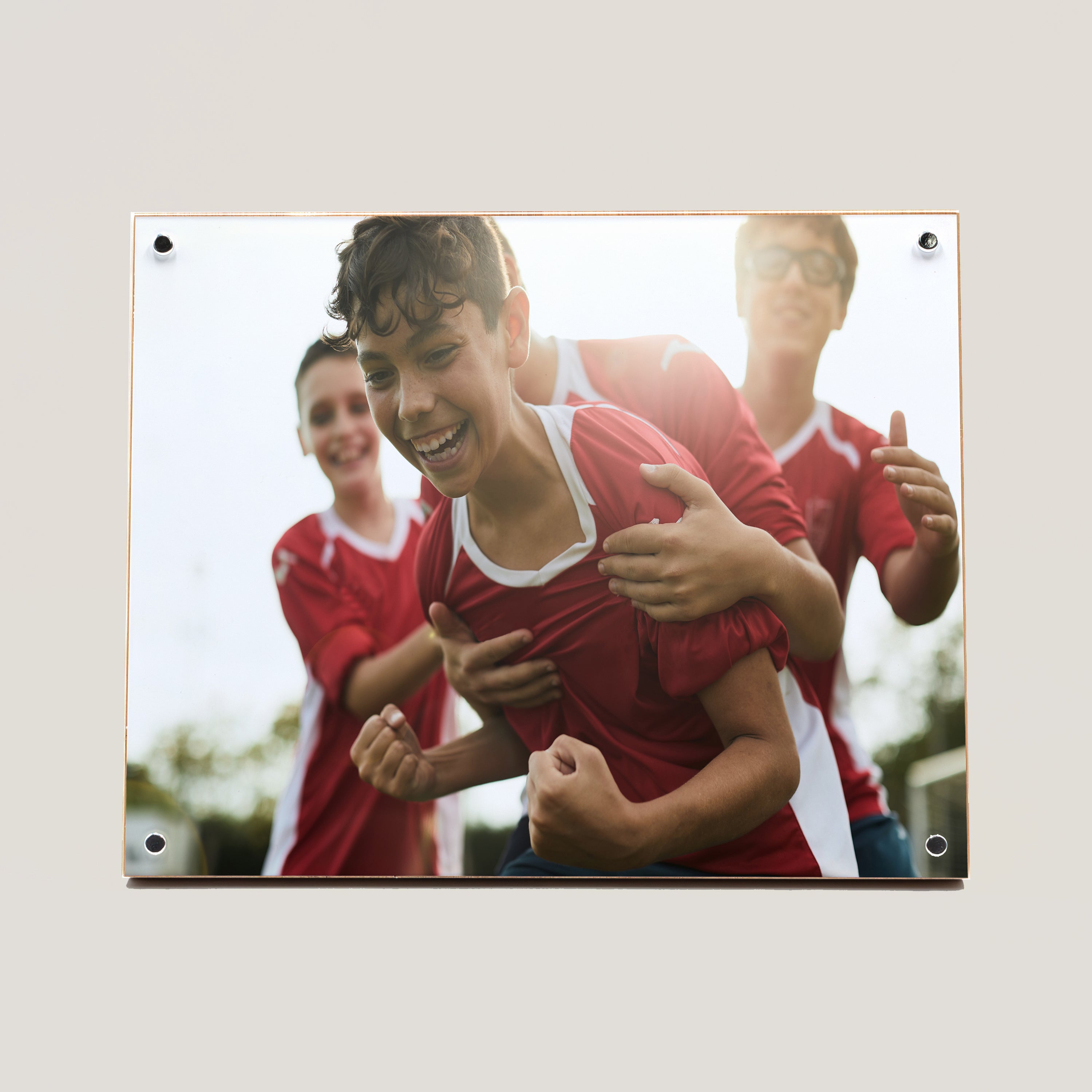 A custom bamboo panel with a photo print of three individuals celebrating, likely indicating a sports-related event.