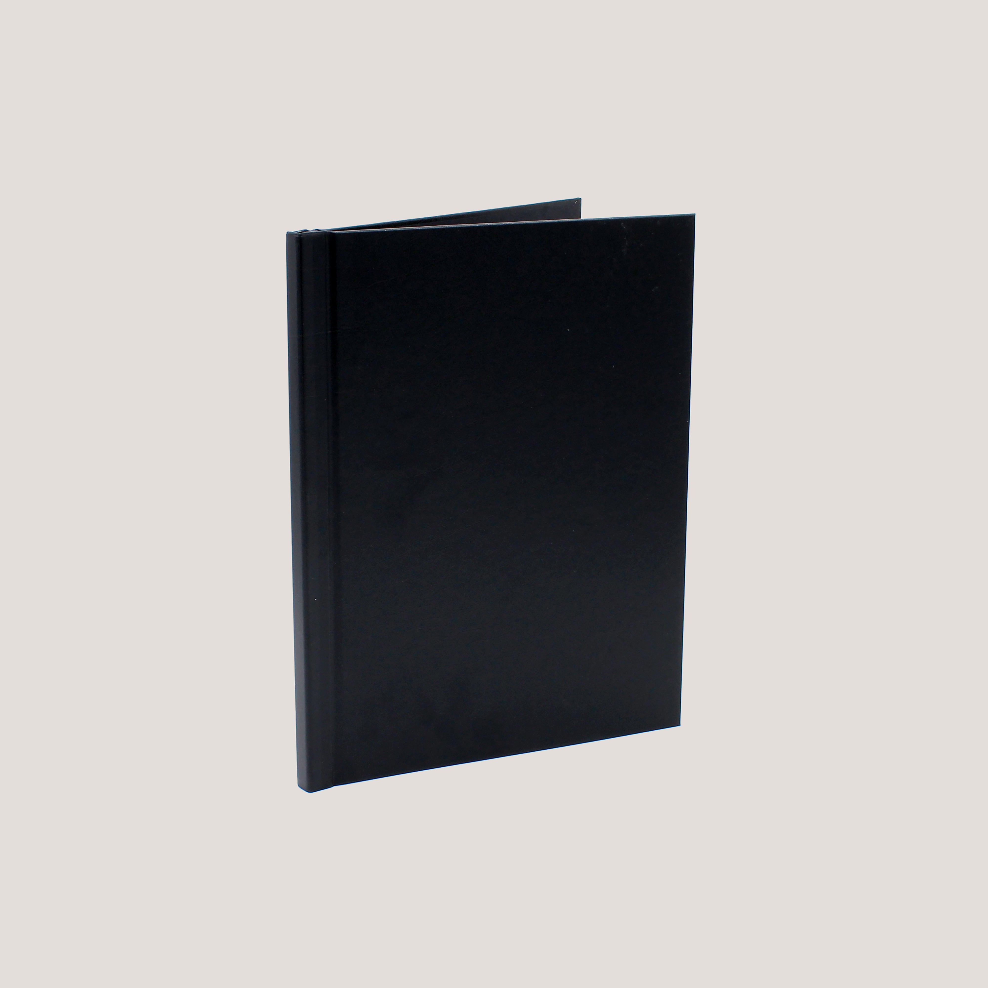 A black clamp binding photobook with a hard cover displayed open to show the binding mechanism.