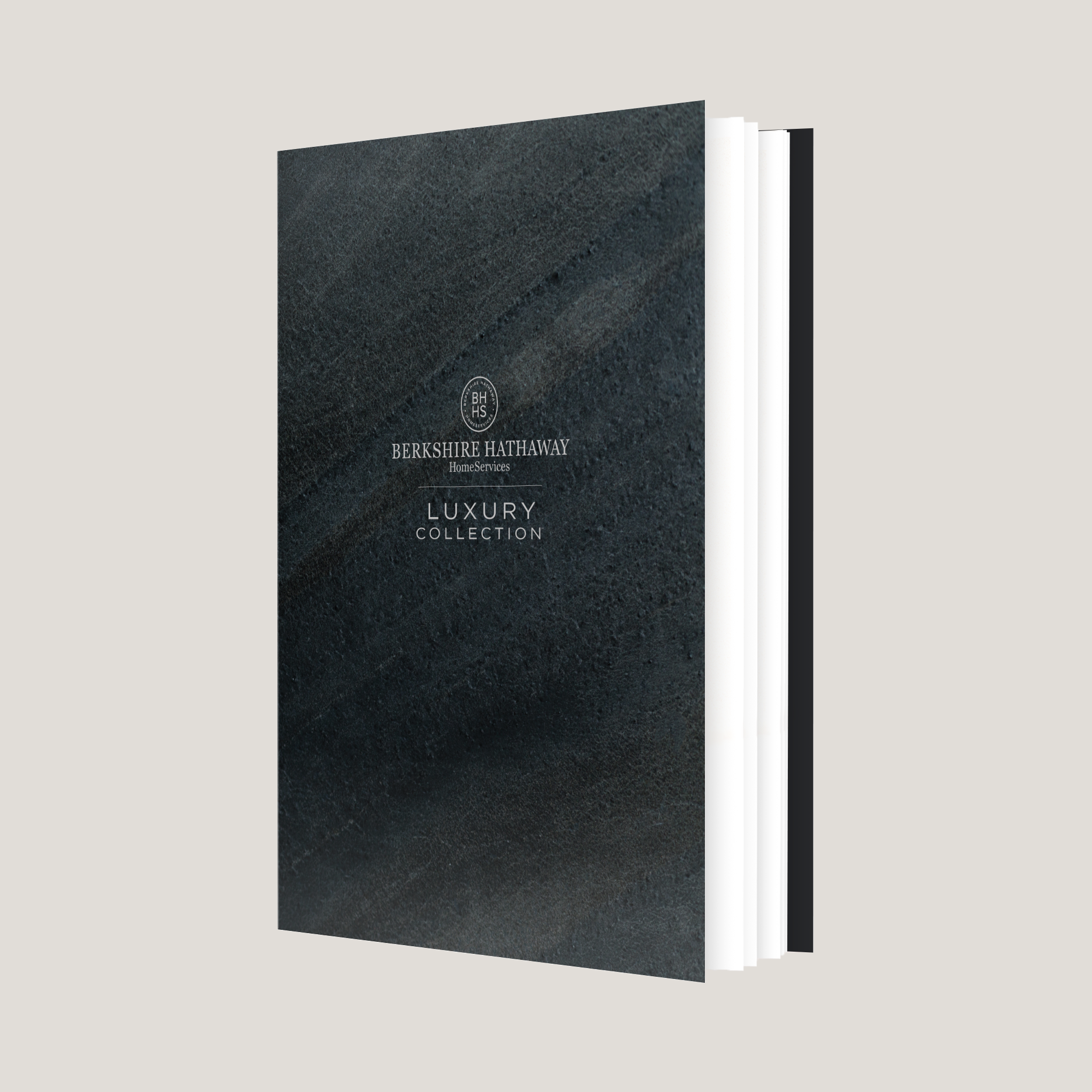Black leather-bound book with 'Berkshire Hathaway' branding on a light gray background