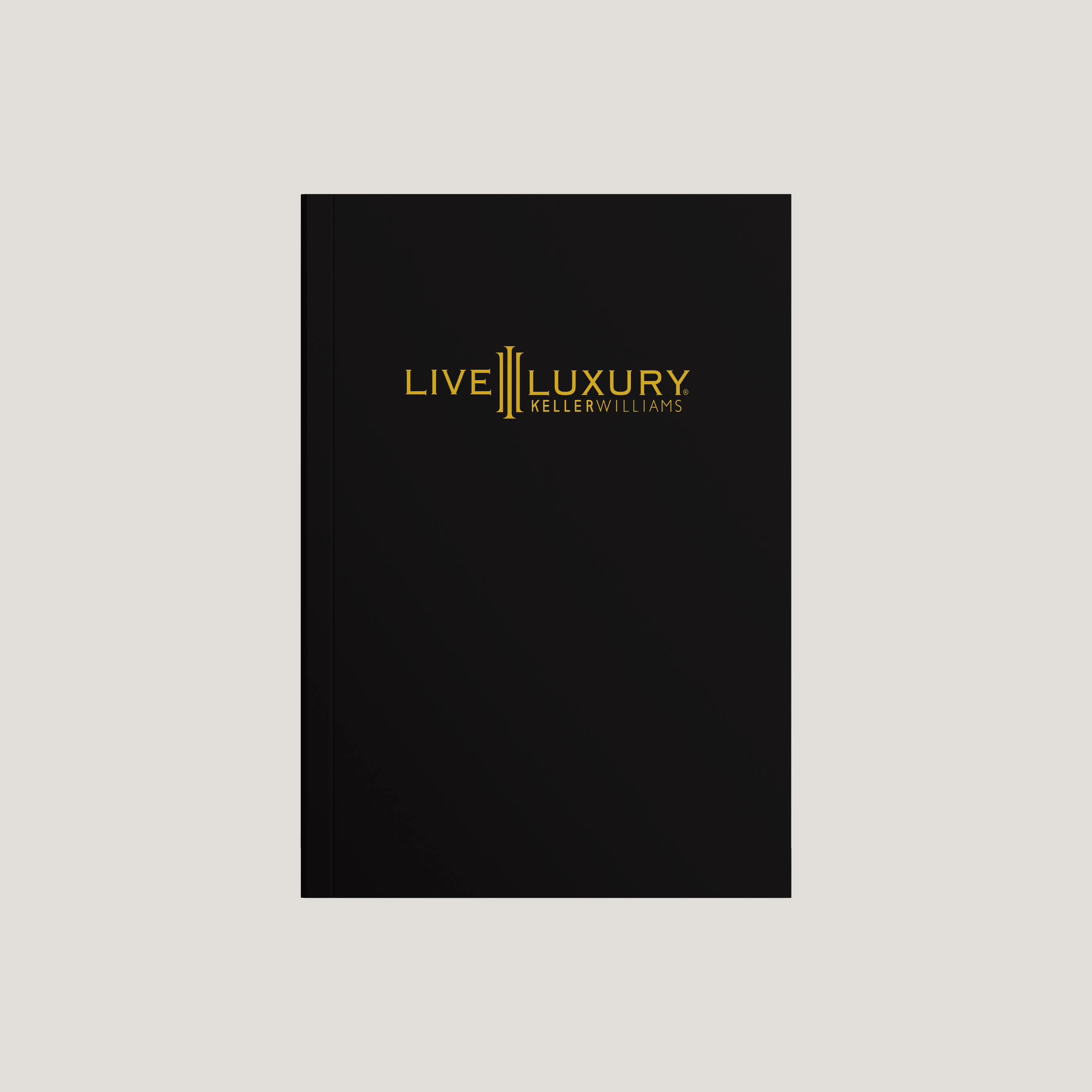 Black book with 'Live Luxury Keller Williams' logo on a light gray background