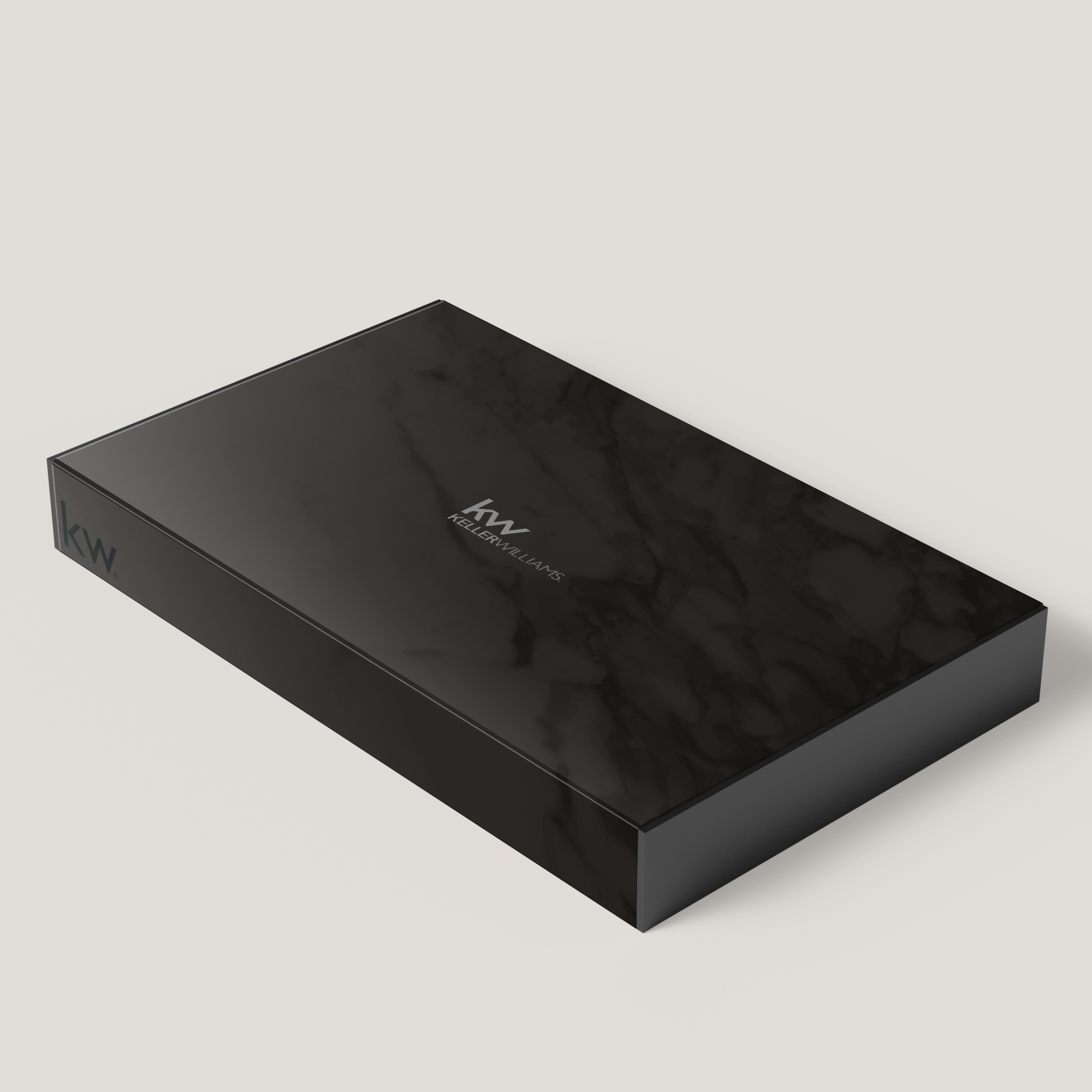 A black marble presentation box with the Keller Williams logo on it.