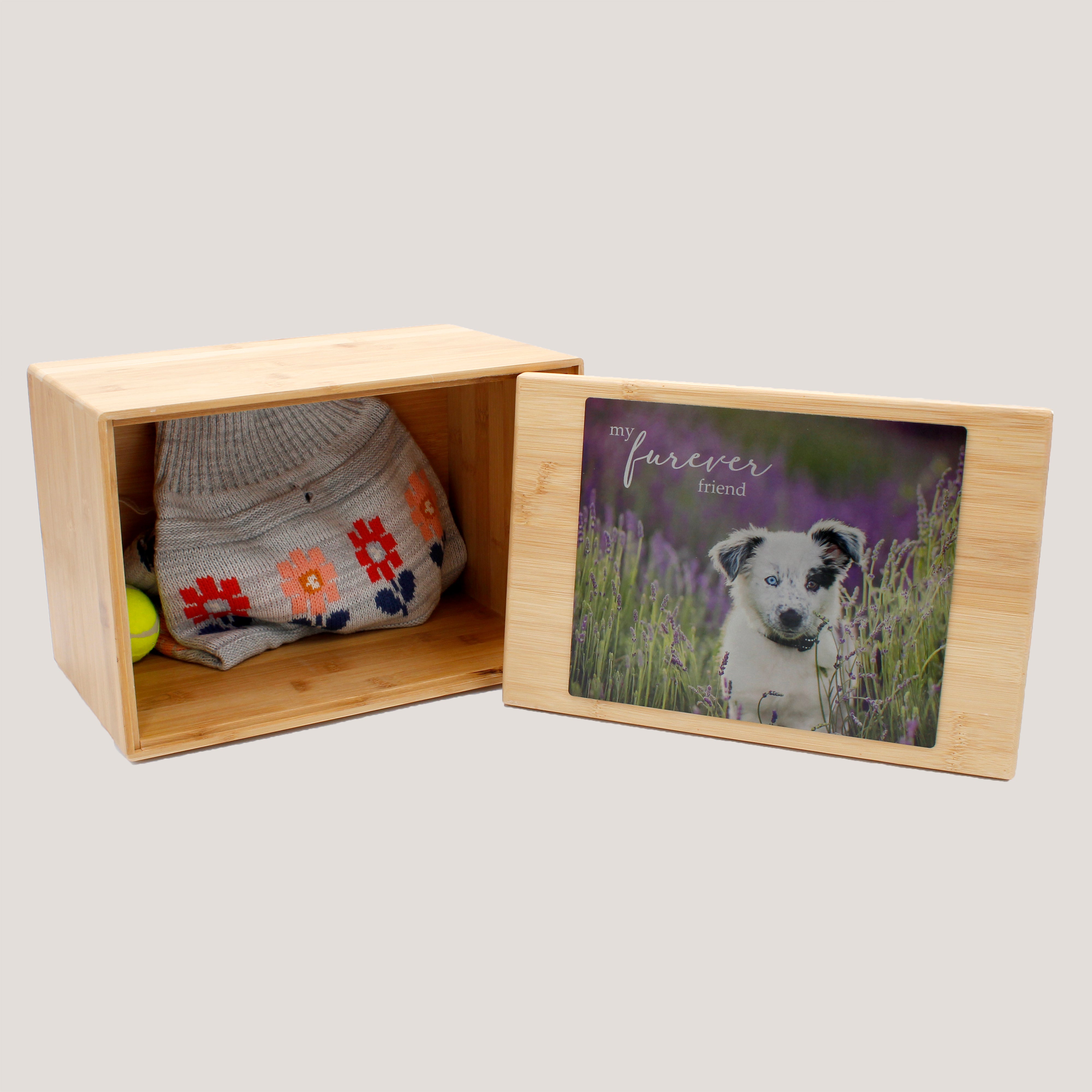 A bamboo box with a soft bamboo touch containing a keepsake, with a detachable lid that has a photo frame displaying a picture of a dog.