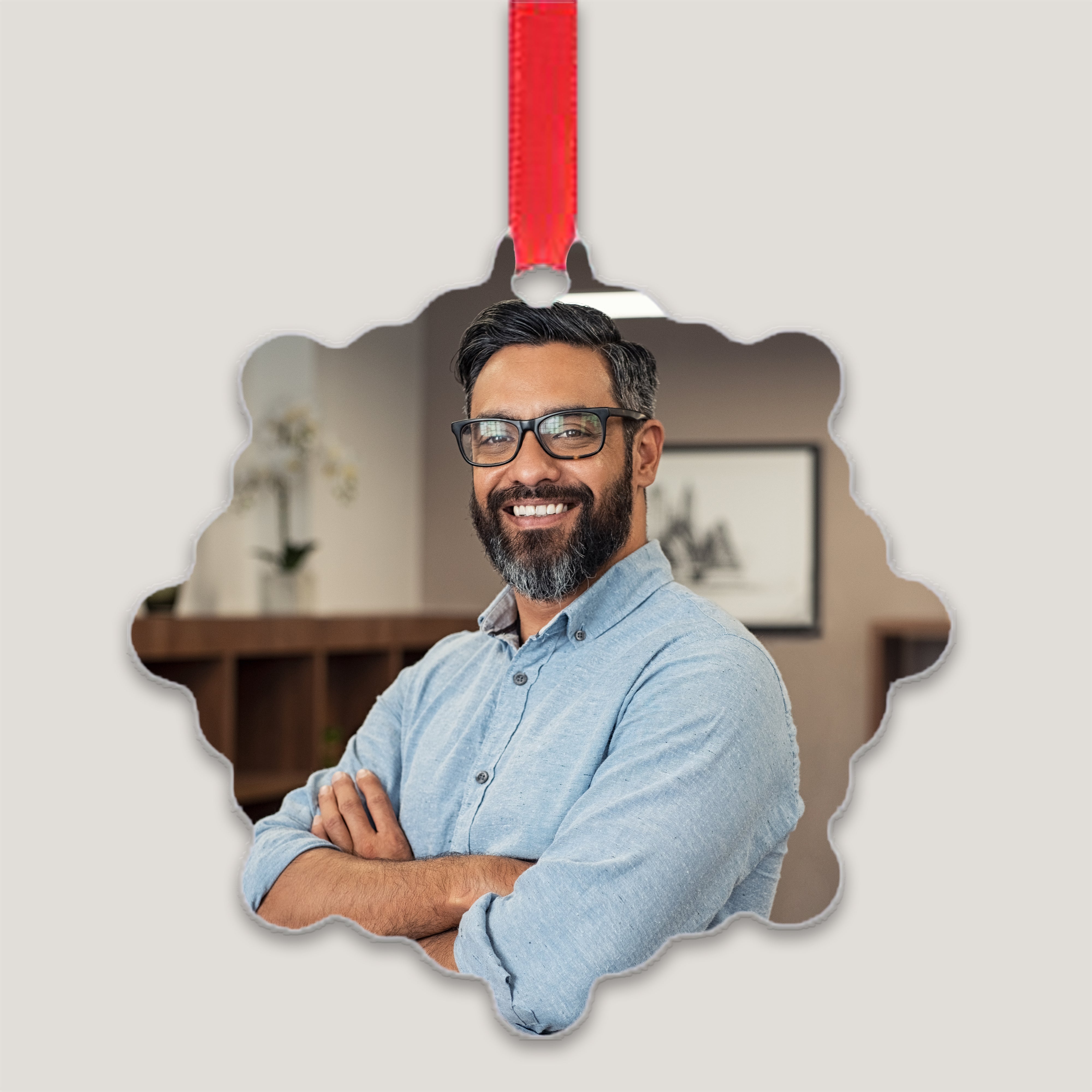 A set of custom metal ornament plates with a photo printed on each. The photos feature diverse individuals and the plates are displayed with red ribbons for hanging.