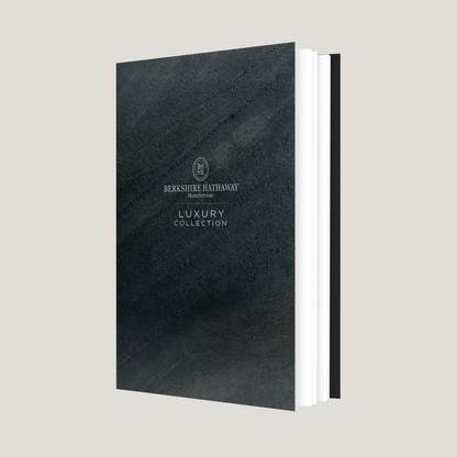 Black leather-bound book with 'Berkshire Hathaway' branding on a light gray background