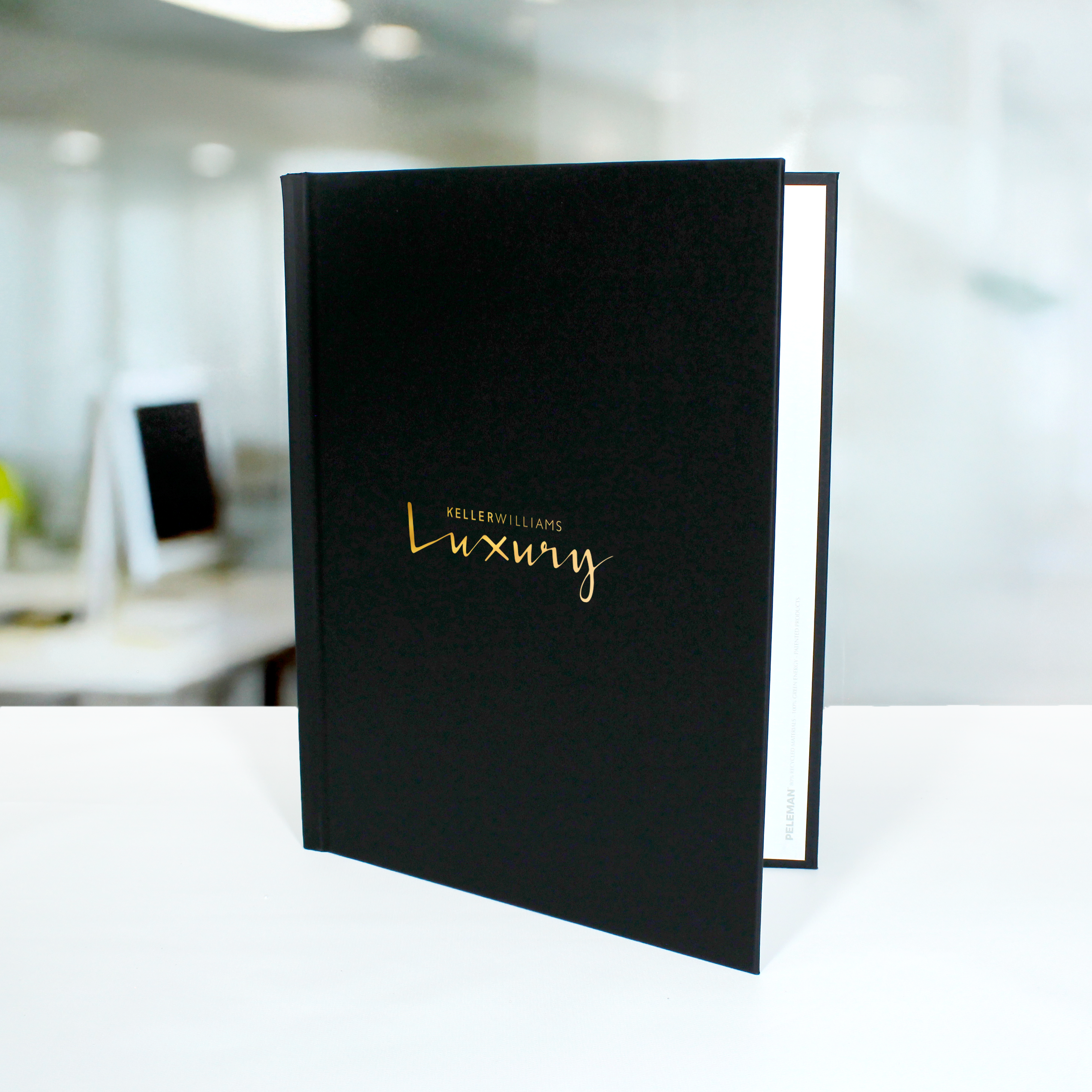Peleman hardcover with gold foil stamping — luxury metallic finish for premium presentations