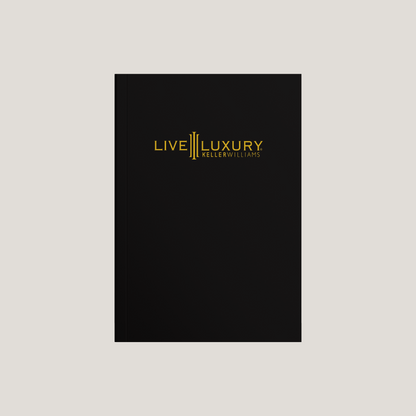 Black book with 'Live Luxury Keller Williams' logo on a light gray background