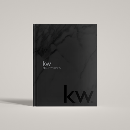 A black marble patterned hardcover notebook with the Keller Williams logo on the cover.