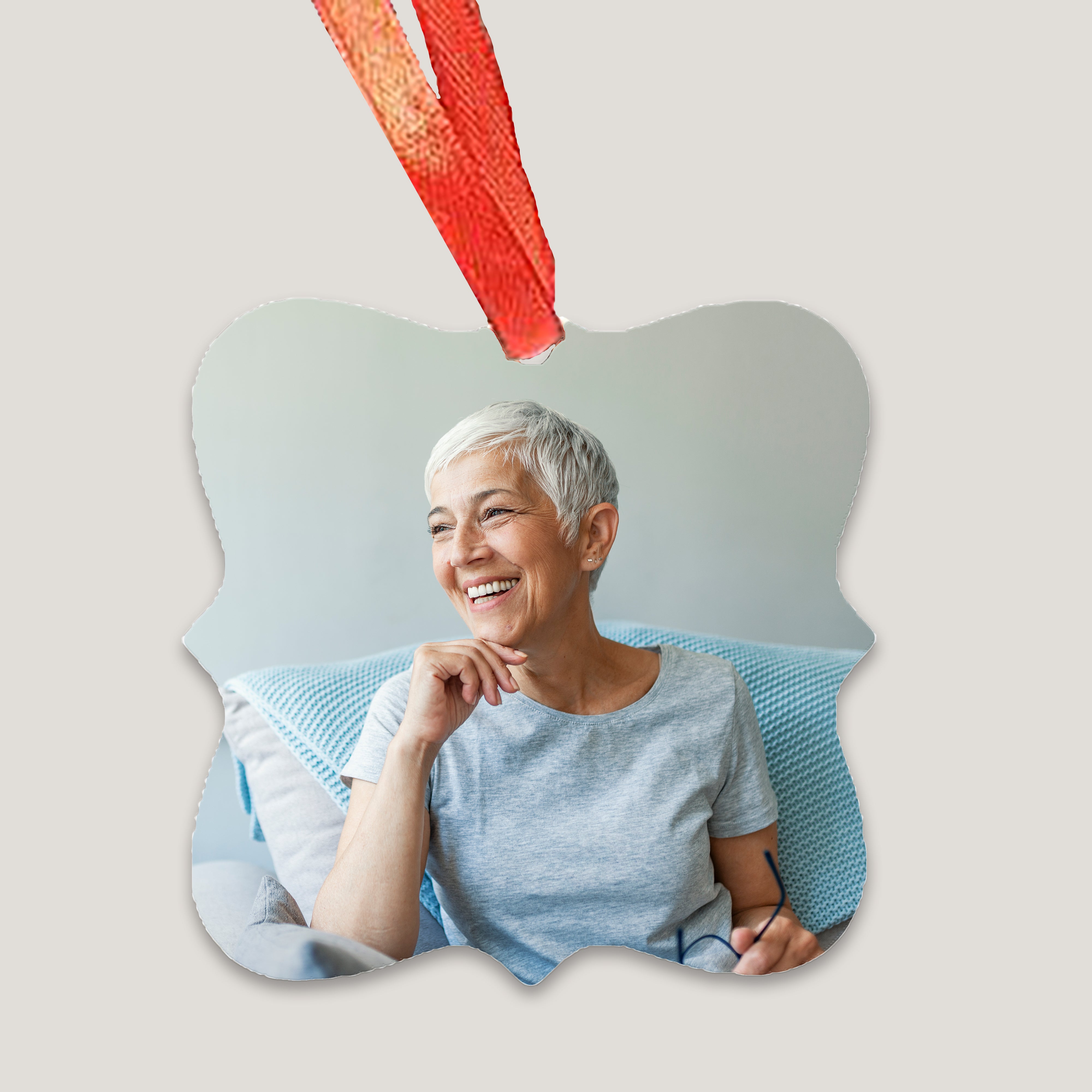 A set of custom metal ornament plates with a photo printed on each. The photos feature diverse individuals and the plates are displayed with red ribbons for hanging.