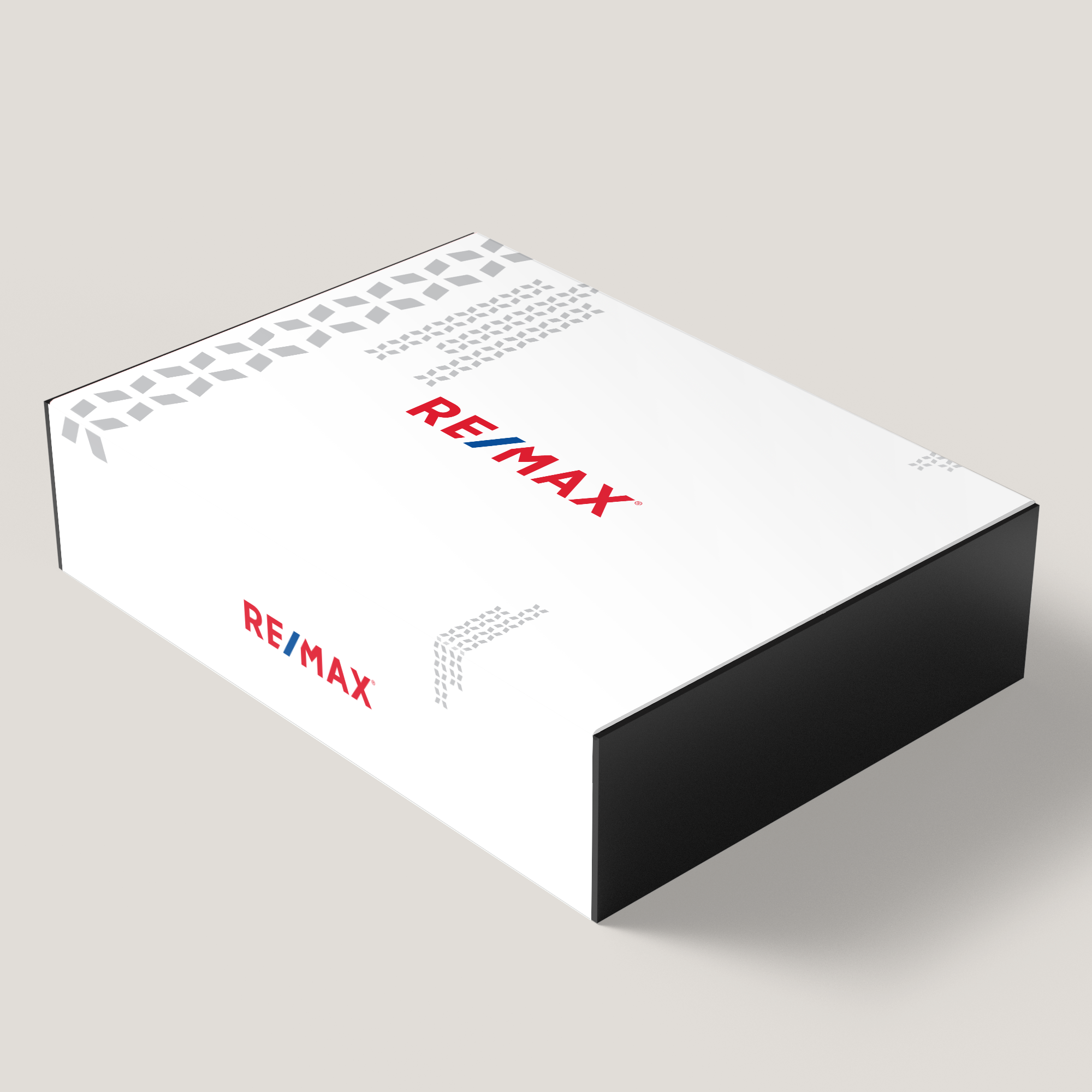 A white gift box with the RE/MAX logo printed in red and black on the sides.