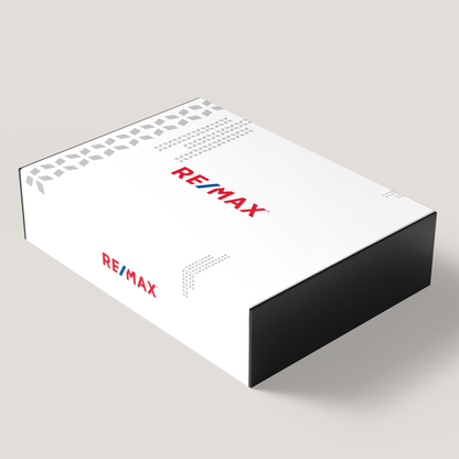 A white gift box with the RE/MAX logo printed in red and black on the sides.