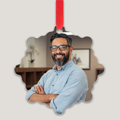 A set of custom metal ornament plates with a photo printed on each. The photos feature diverse individuals and the plates are displayed with red ribbons for hanging.