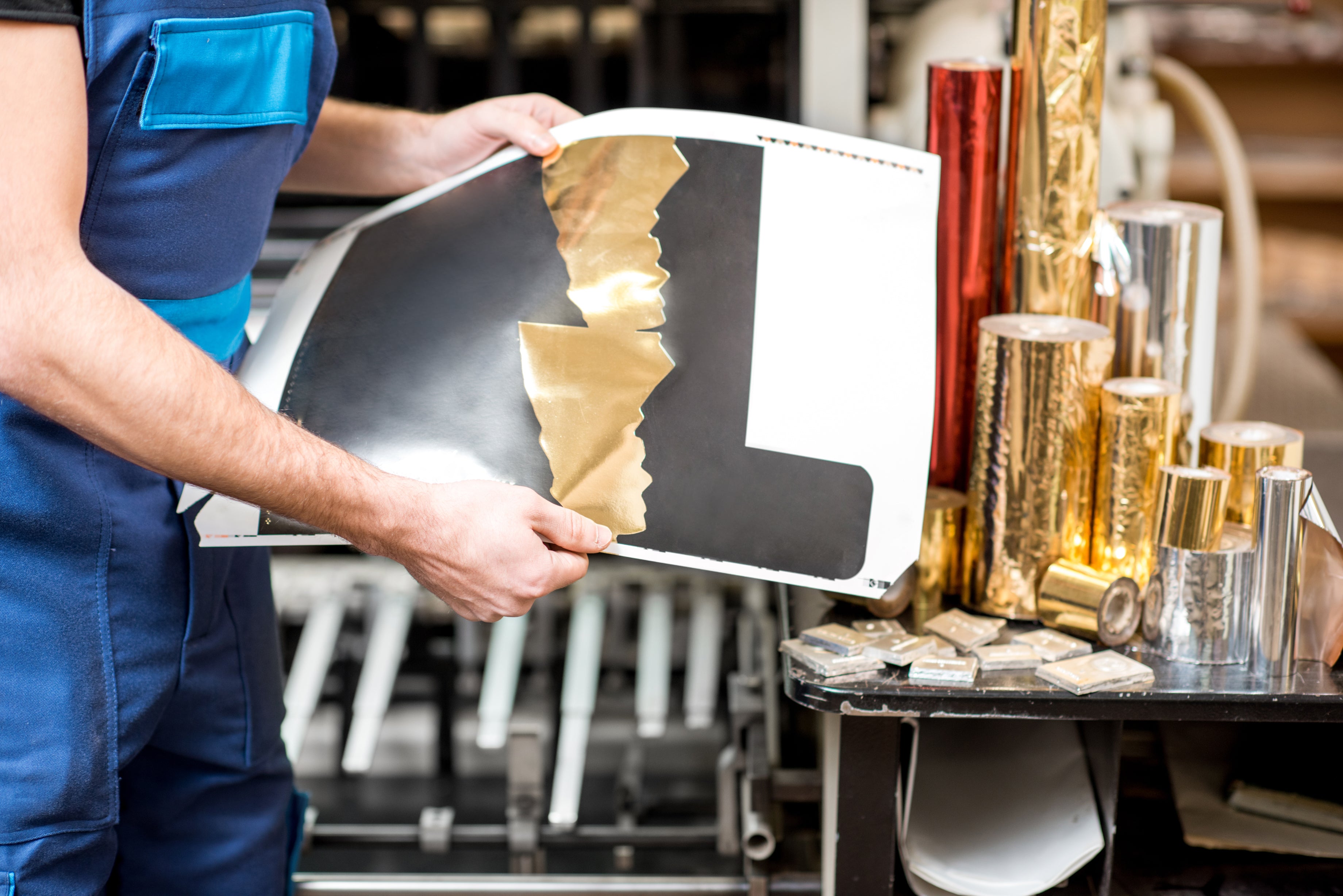Foil stamping in action — premium metallic finishing on hardcover books by Peleman